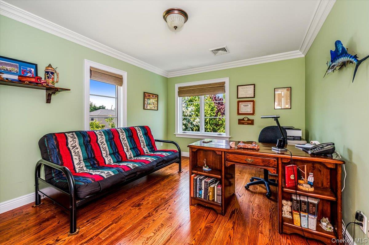83 Ithaca Avenue Atlantic Beach, NY 11509 - Photo 27 of 45 Office area featuring ornamental molding, healthy amount of natural light, and wood finished floors