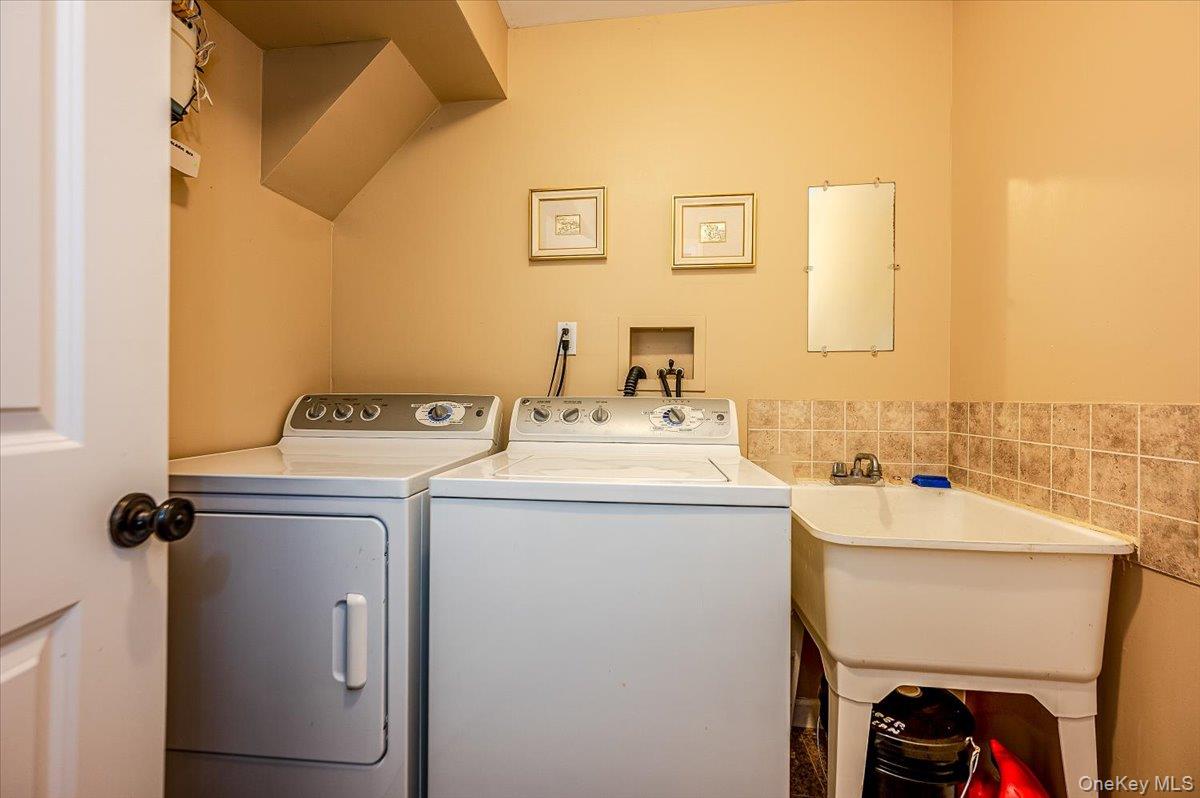 83 Ithaca Avenue Atlantic Beach, NY 11509 - Photo 34 of 45 Laundry area with washing machine and dryer