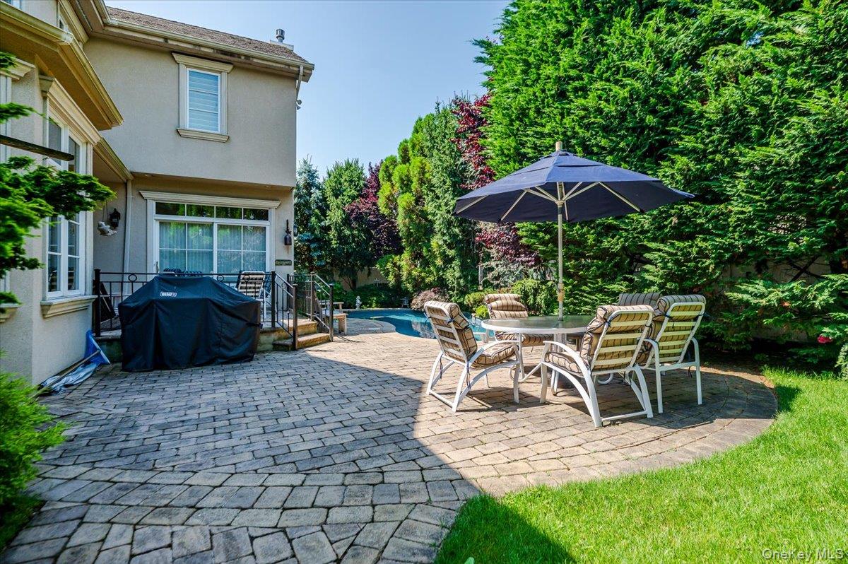 83 Ithaca Avenue Atlantic Beach, NY 11509 - Photo 41 of 45 View of patio featuring a grill and outdoor dining space