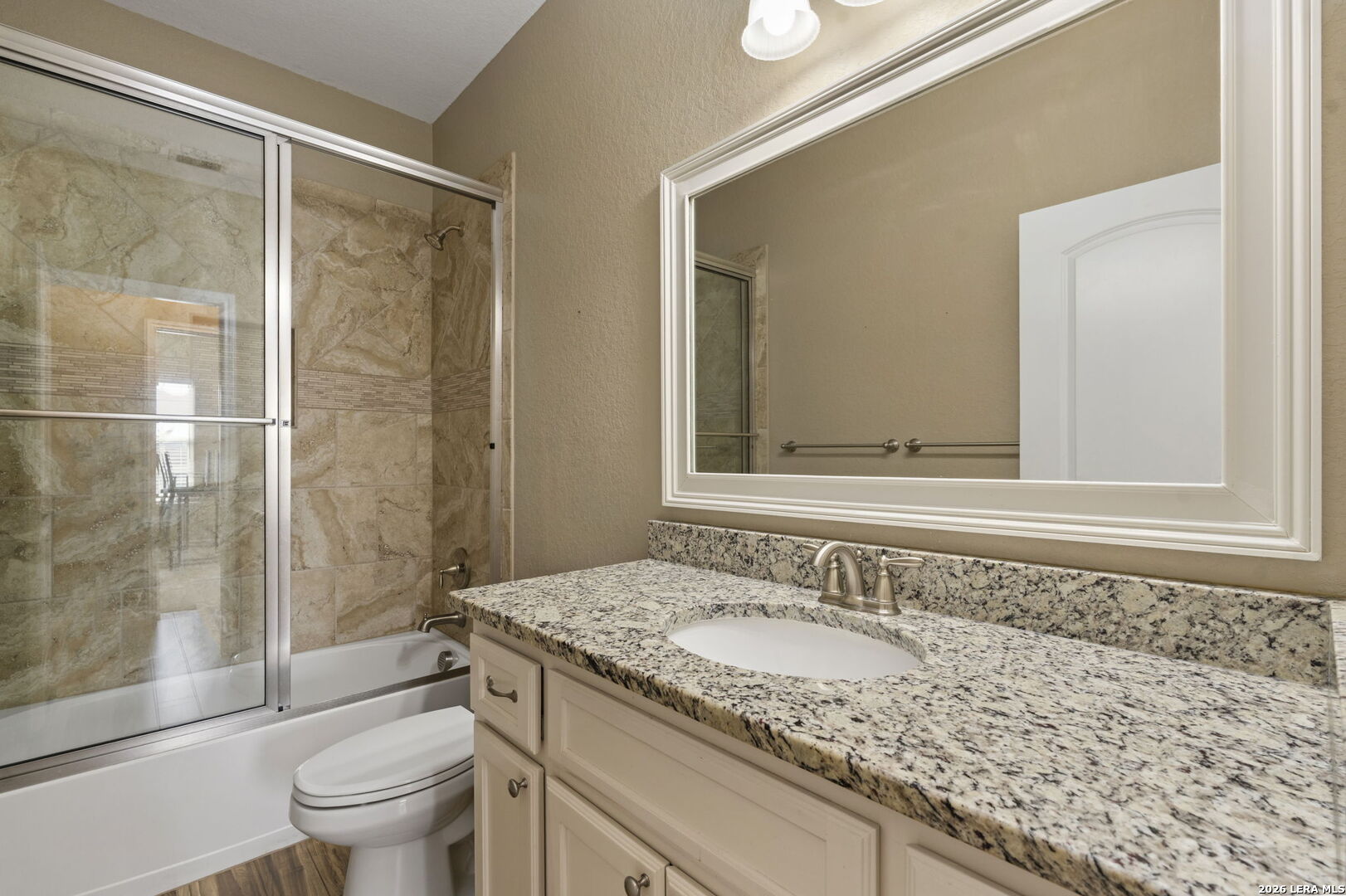 162 Lost Maples Way Marion, TX 78124 - Photo 13 of 18 a bathroom with a granite countertop sink toilet and shower