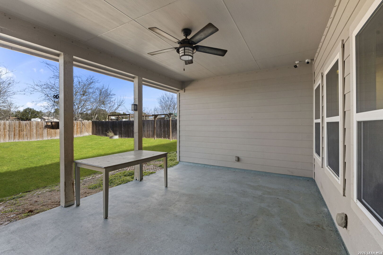 162 Lost Maples Way Marion, TX 78124 - Photo 16 of 18 a view of an empty room with a floor to ceiling window and a ceiling fan