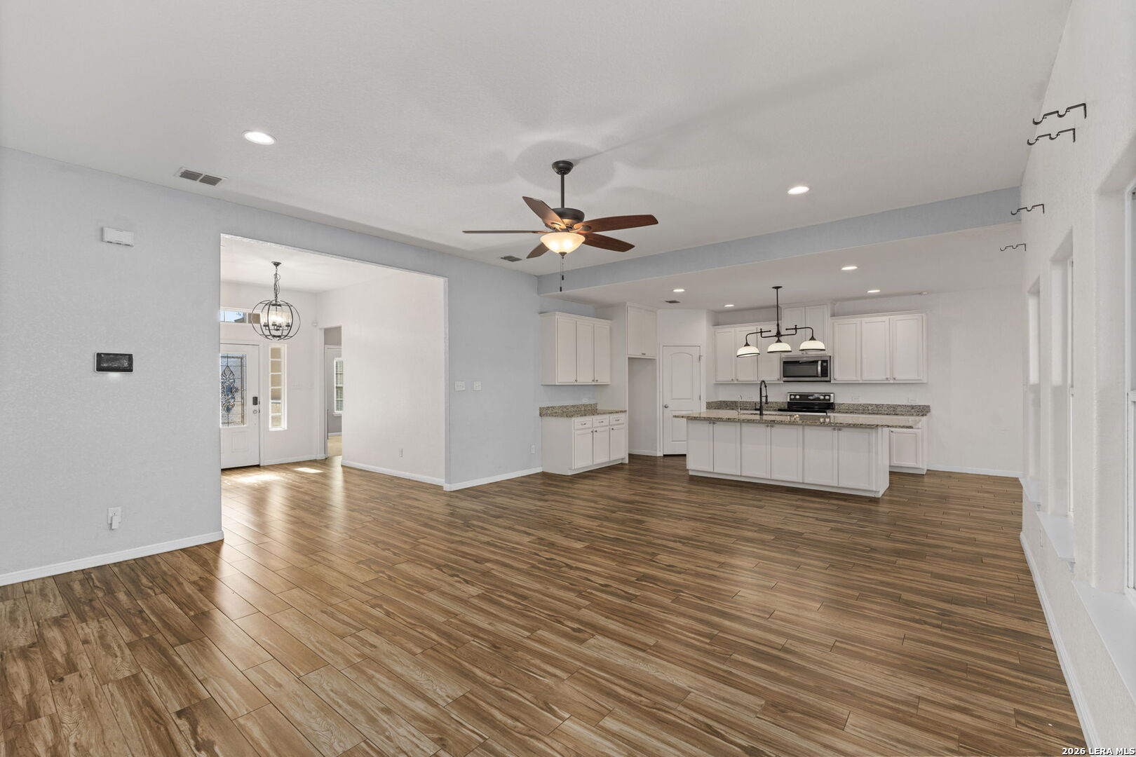 162 Lost Maples Way Marion, TX 78124 - Photo 4 of 18 a view of kitchen with sink microwave and refrigerator