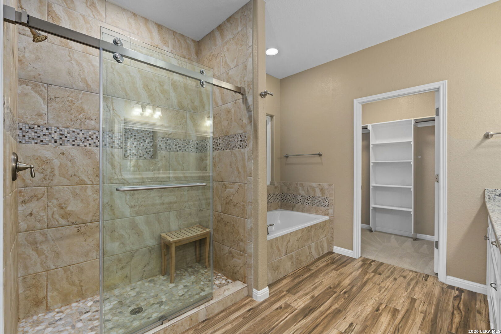 162 Lost Maples Way Marion, TX 78124 - Photo 9 of 18 a bathroom with a bathtub and a shower