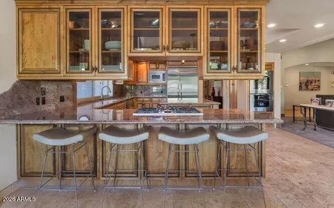a table and chairs in front of the house