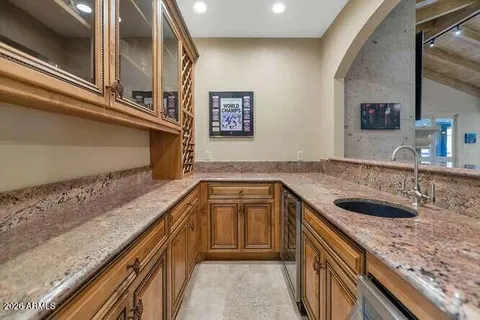 a kitchen with a sink and a refrigerator