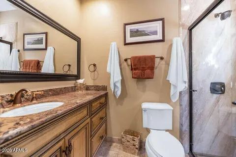 a view of a dining room with a table and chairs