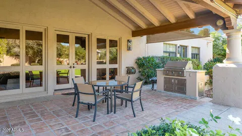 a view of yard with seating area and trees around