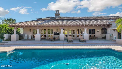 a swimming pool with outdoor seating yard and barbeque oven