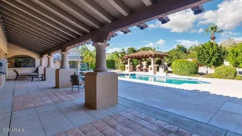 a view of a house with a backyard and a garden