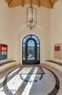 a view of a wooden door with a hallway