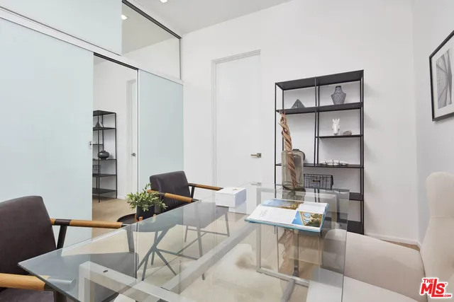 a view of living room with furniture and floor to ceiling window