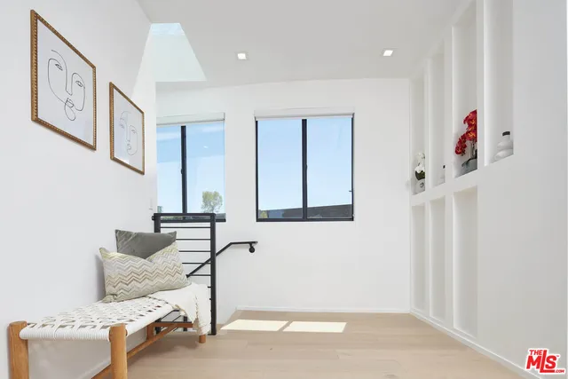 a bedroom with a bed and couch