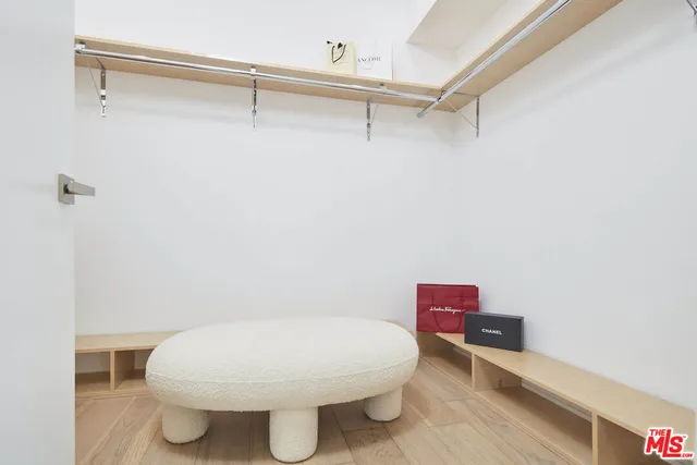 a bedroom with a large bed and a large window