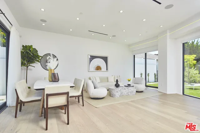 a living room with furniture and windows
