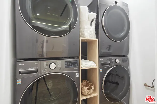 a view of a bathroom with a sink and a wooden floor