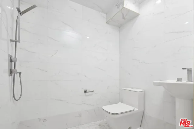 a balcony with table and chairs