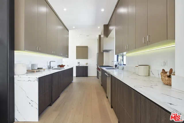 a kitchen with a stove and a sink