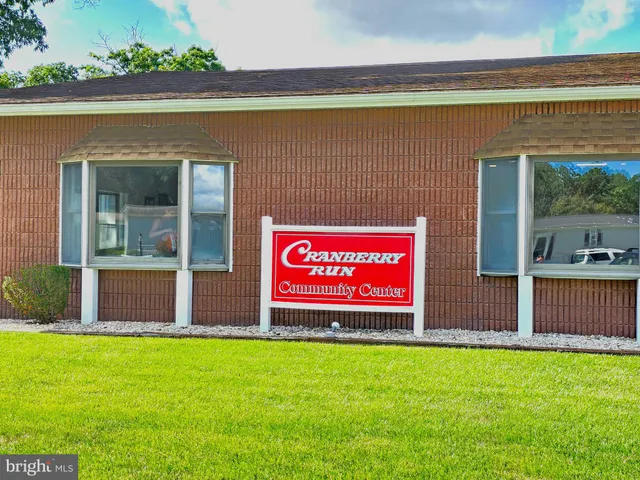 a sign that is sitting in front of a house