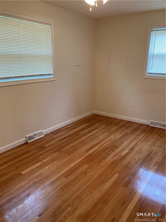 50 Short Beach Road Branford, CT 06405 - Photo 14 of 15 a view of a room with wooden floor and window