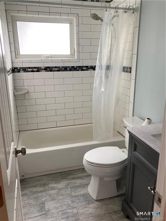 50 Short Beach Road Branford, CT 06405 - Photo 8 of 15 a bathroom with a sink a toilet and a bathtub