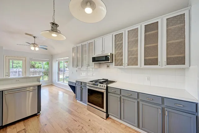 a kitchen with a stove and a microwave