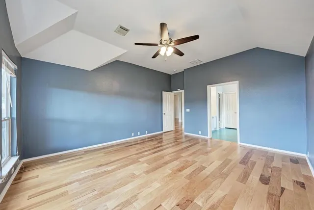 a spacious bathroom with a double vanity sink a mirror and a shower
