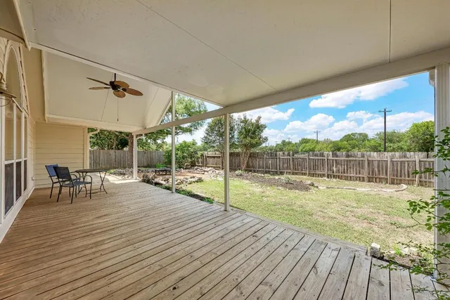 a view of a garden with a building in the background