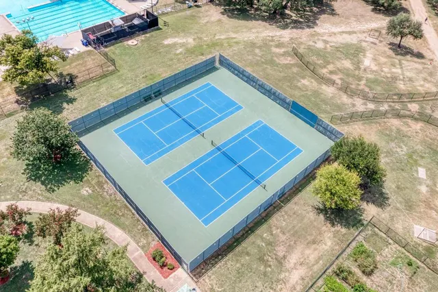 a view of a backyard with sitting area