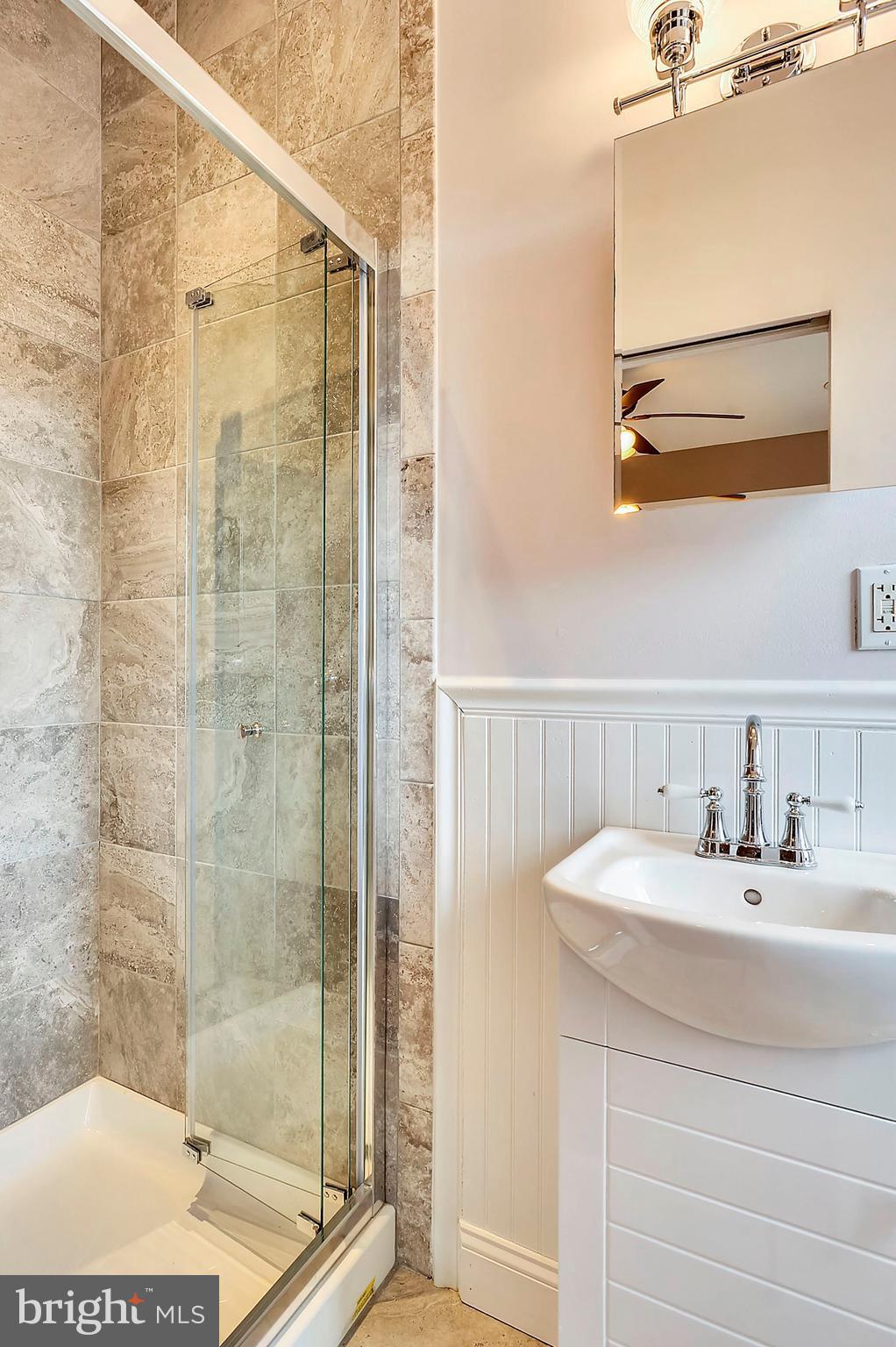 818 12th Street Northeast Washington, DC 20002 - Photo 20 of 29 a bathroom with a sink and a mirror