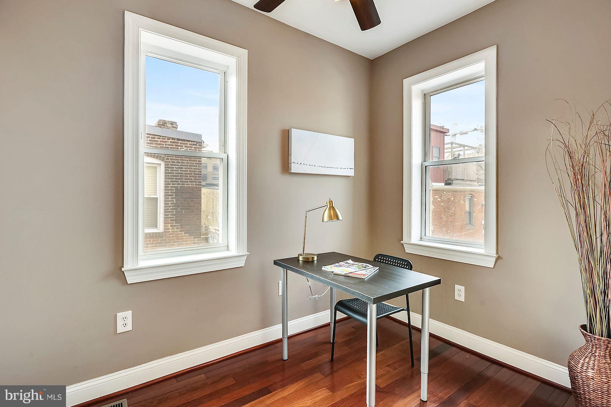818 12th Street Northeast Washington, DC 20002 - Photo 22 of 29 a workspace with wooden floor and a window