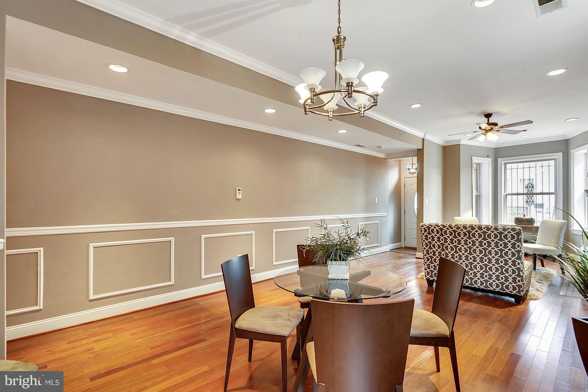 818 12th Street Northeast Washington, DC 20002 - Photo 4 of 29 a view of a dining room with furniture wooden floor and chandelier
