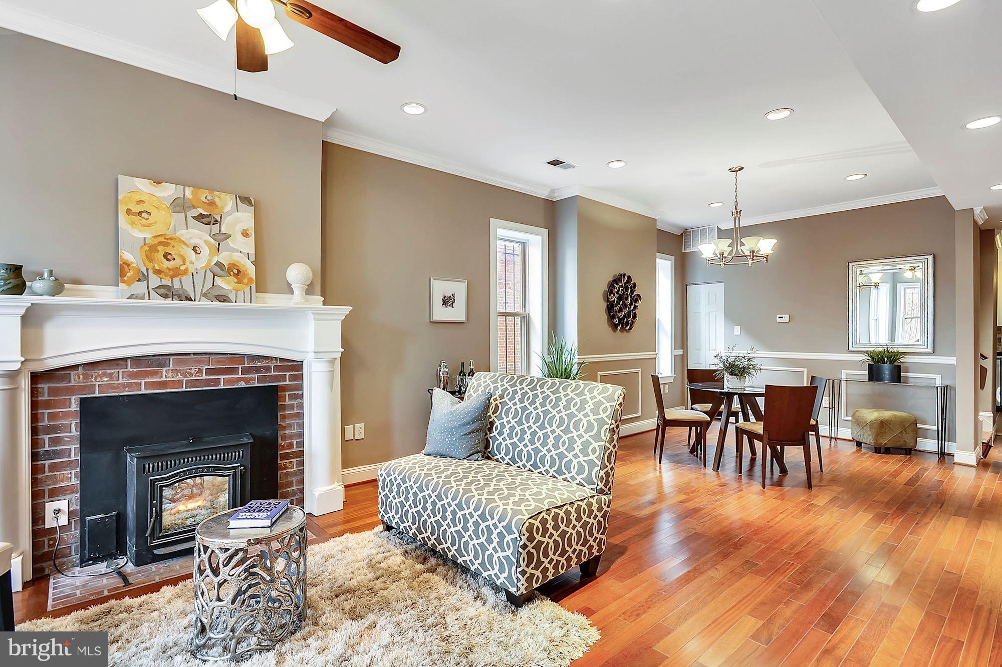 818 12th Street Northeast Washington, DC 20002 - Photo 6 of 29 a living room with furniture and a fireplace