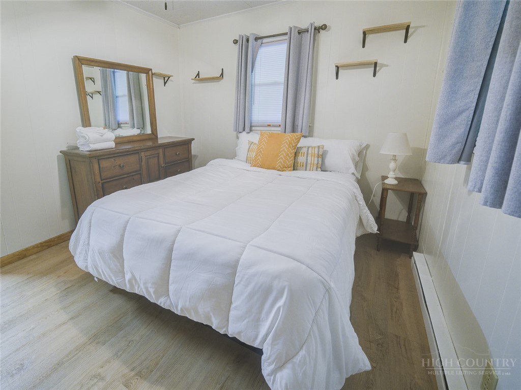 1471 Bamboo Road Boone, NC 28607 - Photo 11 of 19 a bedroom with a bed and window