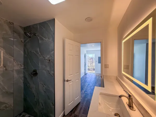 a bathroom with a sink and shower