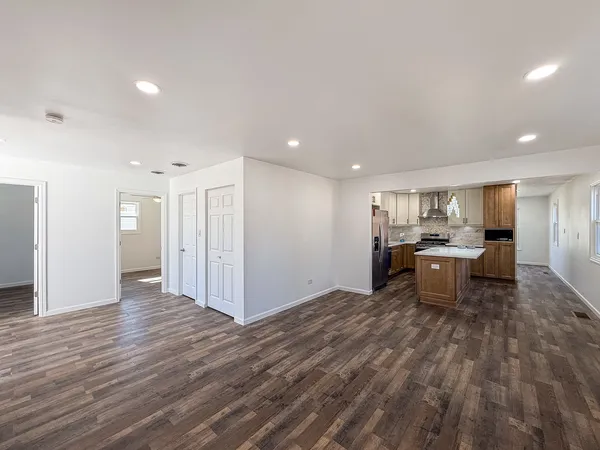 a view of kitchen and dining room with wooden floor
