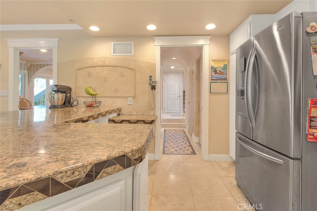 24 Edgebrook Drive Phillips Ranch, CA 91766 - Photo 12 of 75 a kitchen with stainless steel appliances granite countertop a refrigerator and a sink