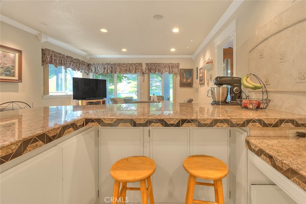 24 Edgebrook Drive Phillips Ranch, CA 91766 - Photo 14 of 75 a kitchen with stainless steel appliances granite countertop a sink stove and microwave