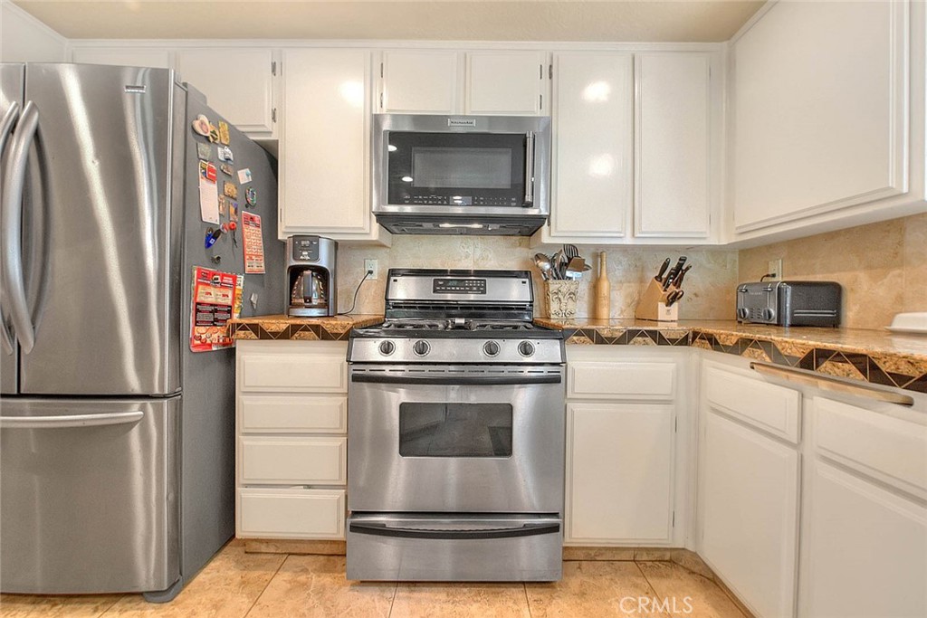 24 Edgebrook Drive Phillips Ranch, CA 91766 - Photo 17 of 75 Gas range and a built-in microwave