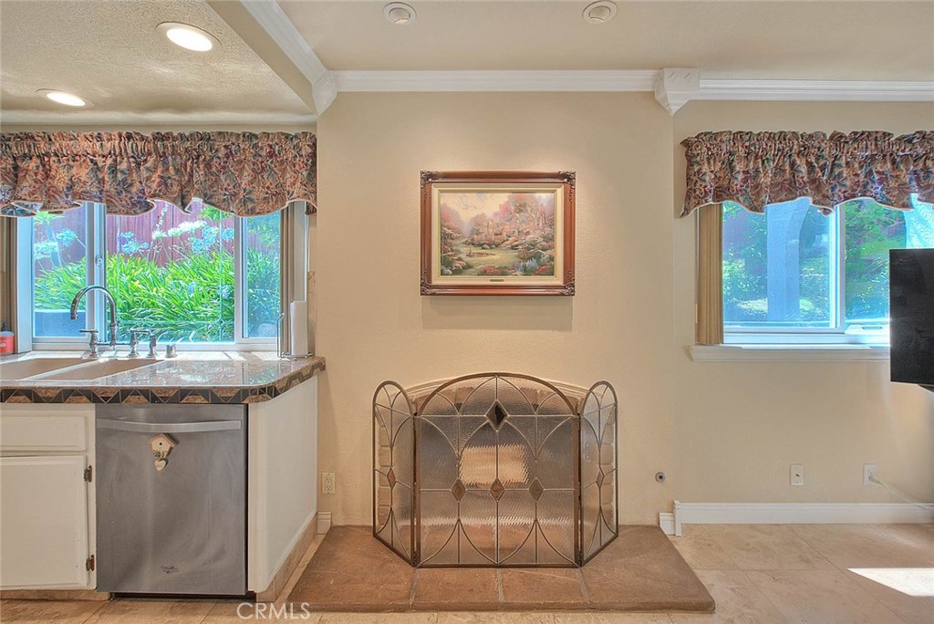 24 Edgebrook Drive Phillips Ranch, CA 91766 - Photo 18 of 75 Fireplace between the kitchen and family room