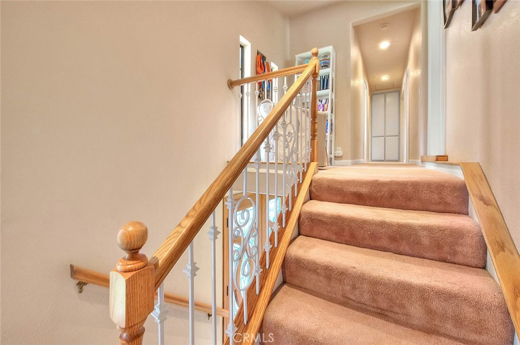 24 Edgebrook Drive Phillips Ranch, CA 91766 - Photo 22 of 75 a view of staircase with rug and white walls