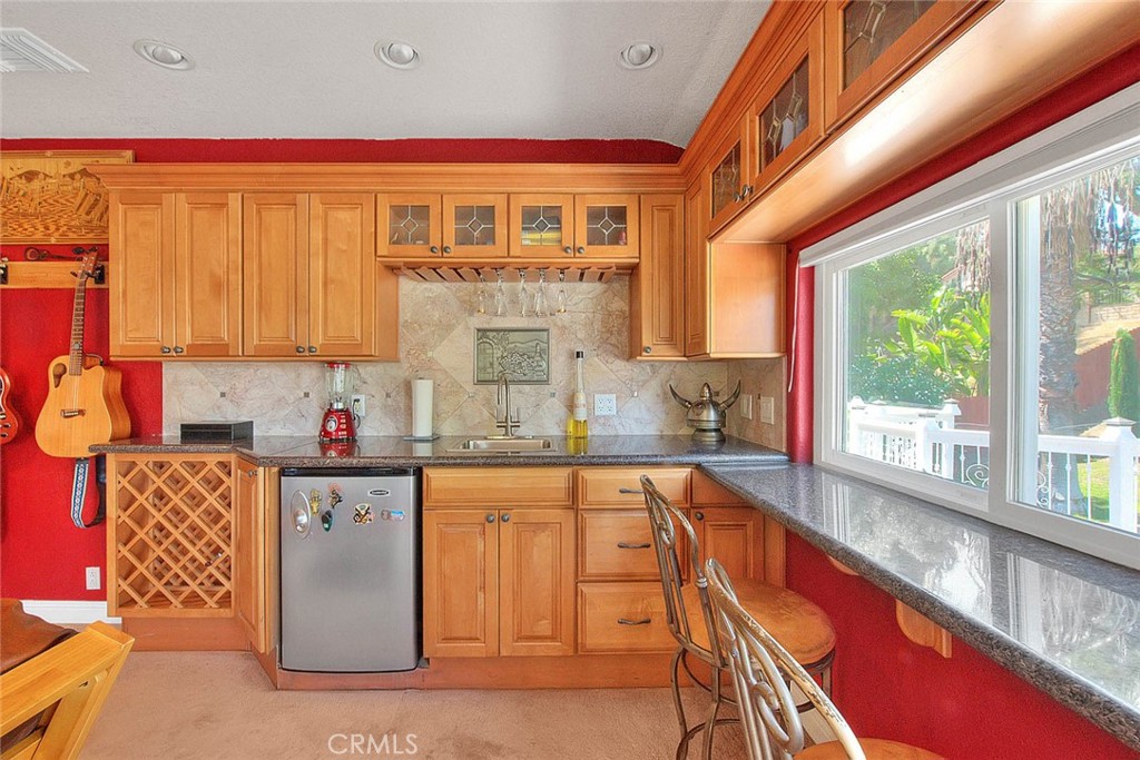 24 Edgebrook Drive Phillips Ranch, CA 91766 - Photo 29 of 75 a kitchen with stainless steel appliances granite countertop a refrigerator and sink