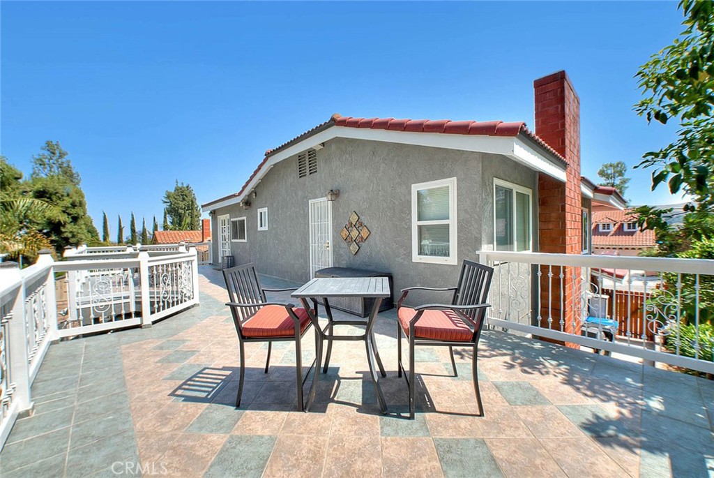 24 Edgebrook Drive Phillips Ranch, CA 91766 - Photo 32 of 75 a patio with table and chairs and potted plants