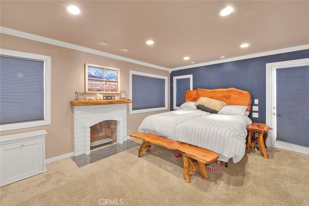 24 Edgebrook Drive Phillips Ranch, CA 91766 - Photo 40 of 75 a bedroom with a bed and a fireplace