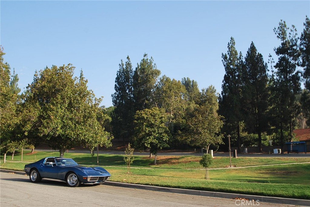 24 Edgebrook Drive Phillips Ranch, CA 91766 - Photo 70 of 75 a view of a car parked in front of a yard