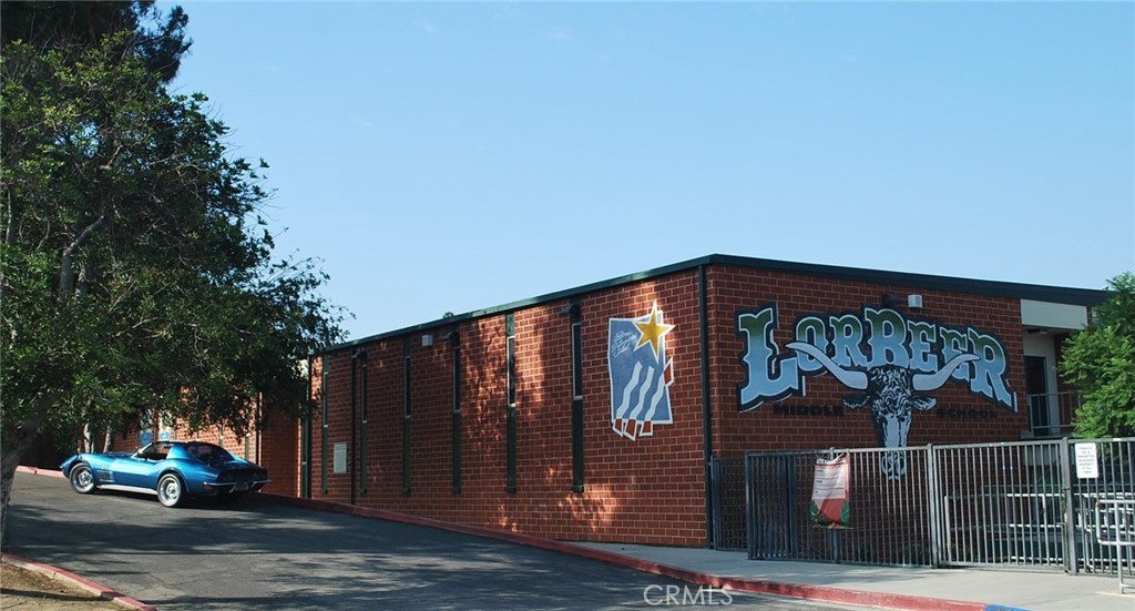 24 Edgebrook Drive Phillips Ranch, CA 91766 - Photo 73 of 75 a front view of a house with parking area