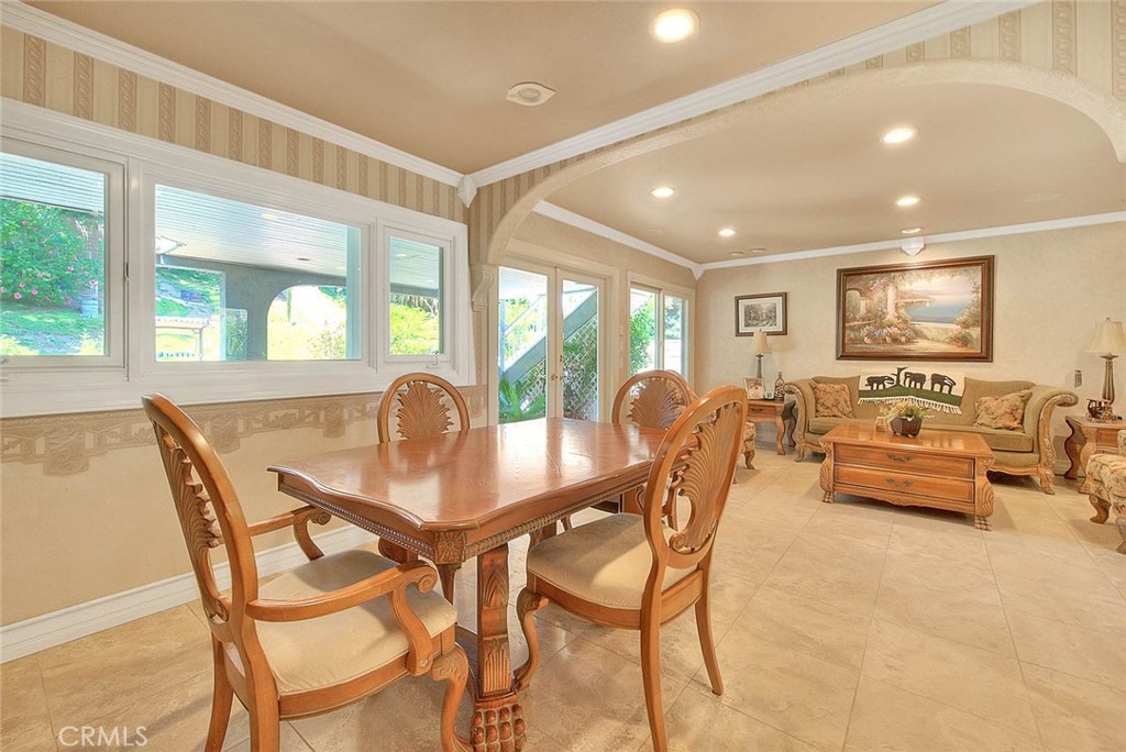 24 Edgebrook Drive Phillips Ranch, CA 91766 - Photo 9 of 75 a view of a dining room with furniture large windows and wooden floor