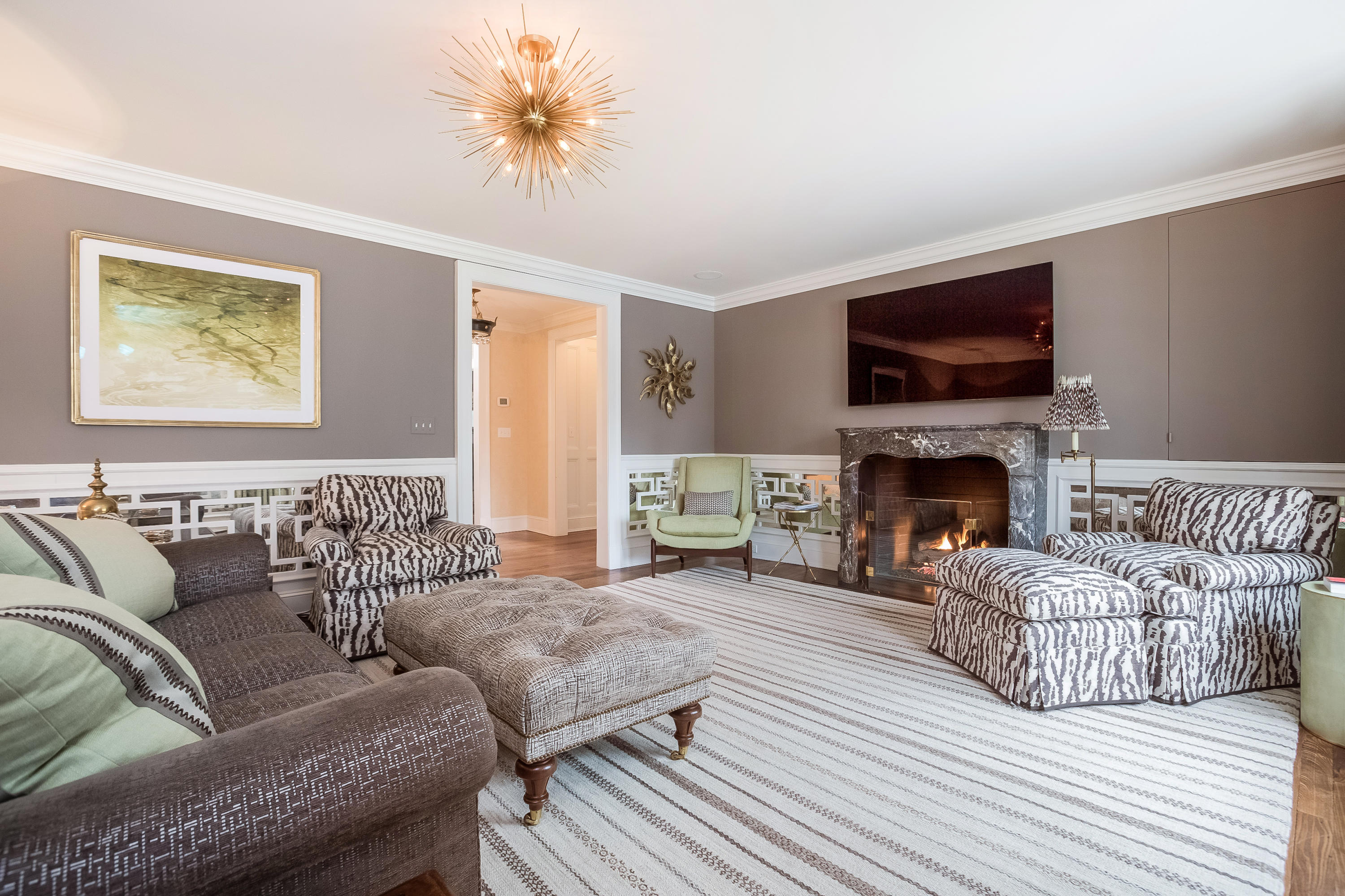 29 Sunswyck Road Darien, CT 06820 - Photo 14 of 59 a living room with furniture fireplace and a flat screen tv