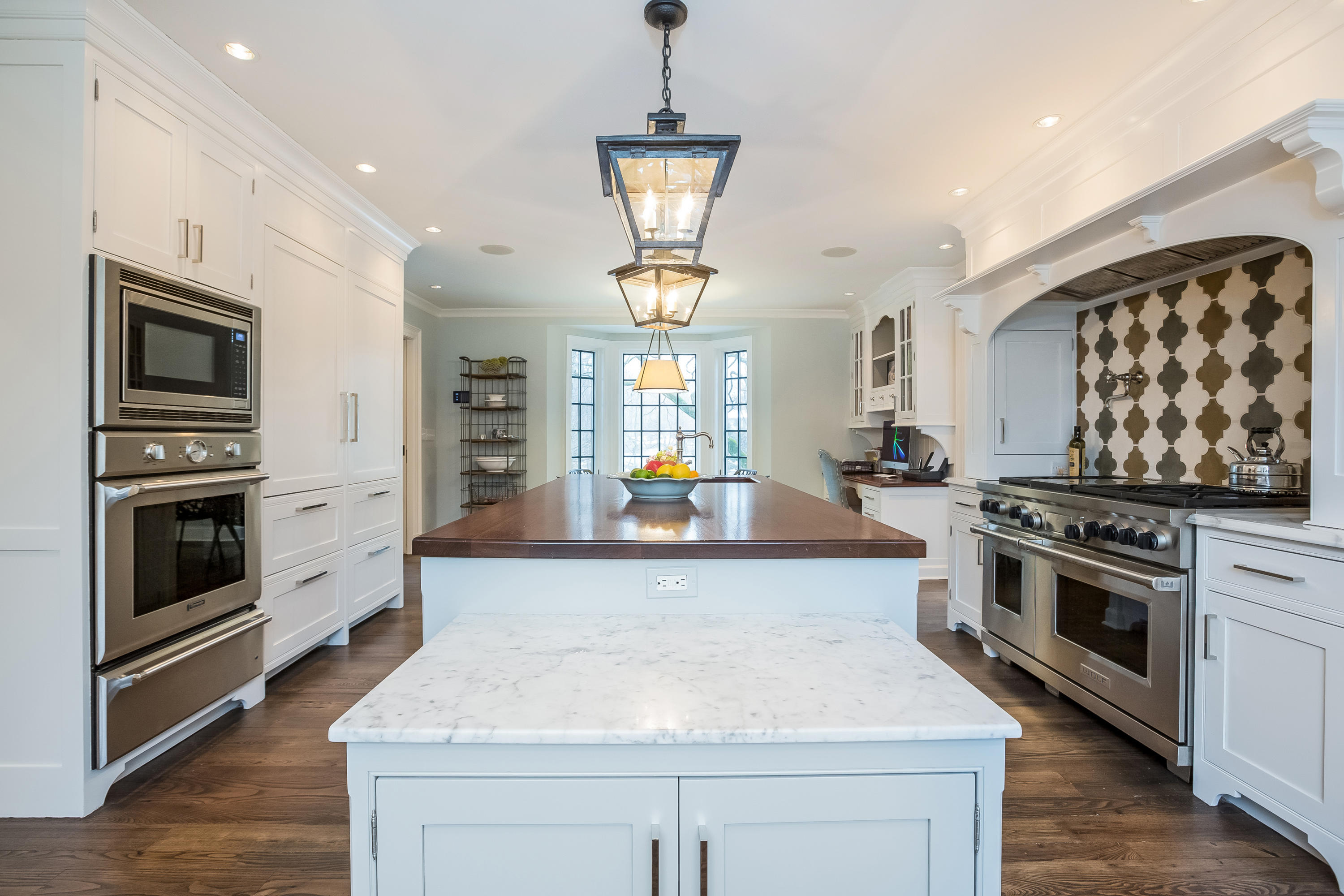 29 Sunswyck Road Darien, CT 06820 - Photo 18 of 59 a large kitchen with stainless steel appliances granite countertop a stove and a sink