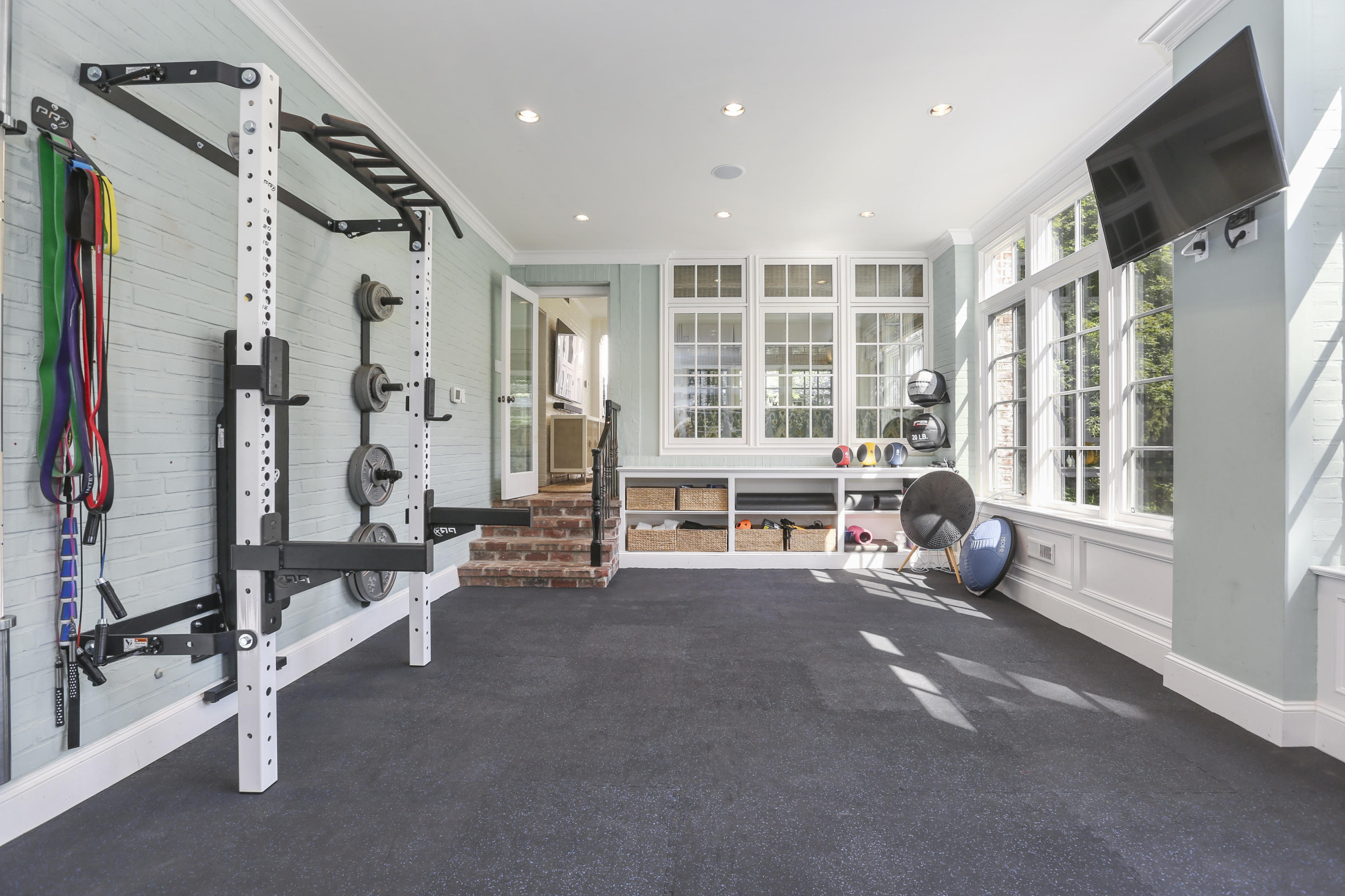 29 Sunswyck Road Darien, CT 06820 - Photo 25 of 59 a view of a room with gym equipment and a large window