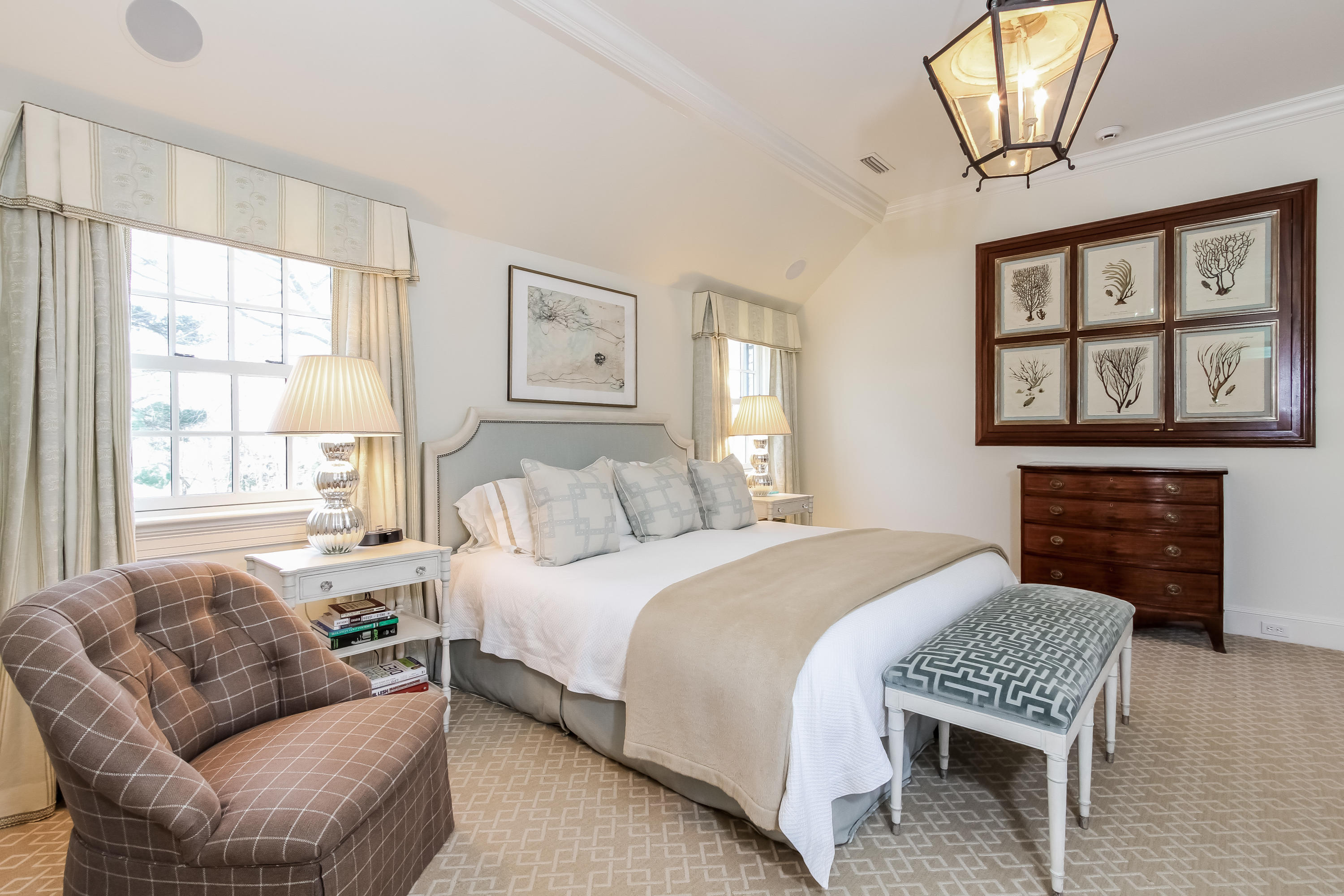 29 Sunswyck Road Darien, CT 06820 - Photo 31 of 59 a bedroom with a bed couches and a fireplace